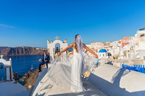 Young wedding couple on the rooftops of Santorini, Greece